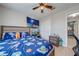 Well-lit bedroom with a large closet and TV, offering comfort and convenience at 3160 Santa Cruz Dr, Kissimmee, FL 34746