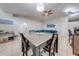 Bright dining room featuring a modern light fixture, tile floors, and a ceiling fan at 3160 Santa Cruz Dr, Kissimmee, FL 34746