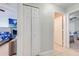 Hallway view featuring multiple closets and doors, offering ample storage at 3160 Santa Cruz Dr, Kissimmee, FL 34746