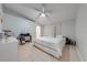 The main bedroom features a ceiling fan, tile floors, and a view to the bathroom at 3160 Santa Cruz Dr, Kissimmee, FL 34746