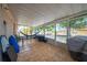 Covered porch with a hammock, exercise equipment, and tiled floor perfect for relaxing at 3160 Santa Cruz Dr, Kissimmee, FL 34746