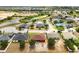 Neighborhood view showing houses with mature trees; ideal for a peaceful residential setting at 318 Highland Meadows Dr, Davenport, FL 33837