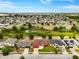 A broad aerial shot displaying homes, greenery, and a neighborhood layout, highlighting its residential appeal at 318 Highland Meadows Dr, Davenport, FL 33837
