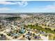 Aerial view of a sprawling suburban community featuring numerous single Gathering homes and well maintained foliage at 318 Highland Meadows Dr, Davenport, FL 33837
