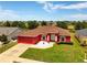 Inviting single-Gathering home with a well-groomed front yard, showcasing its appealing curb appeal and tidy landscaping at 318 Highland Meadows Dr, Davenport, FL 33837