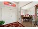 Inviting foyer with tile flooring and dining room featuring elegant chandelier at 318 Highland Meadows Dr, Davenport, FL 33837