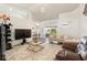 Open living room with neutral walls, plush carpeting, and natural light at 318 Highland Meadows Dr, Davenport, FL 33837