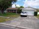 Charming single-story home featuring a well-manicured lawn and attached two-car garage at 3231 Lowndes Dr, Winter Park, FL 32792