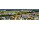 Community aerial view showcasing golf course, water features, and mature landscaping, offering a serene environment at 3256 Countryside View Dr, St Cloud, FL 34772