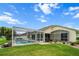 Beautiful backyard with a screened-in pool, patio area, and lush landscaping at 3256 Countryside View Dr, St Cloud, FL 34772