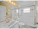 Well-lit bathroom featuring a single sink, toilet, and walk-in glass shower at 3256 Countryside View Dr, St Cloud, FL 34772