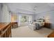 Spacious bedroom featuring tray ceilings, a ceiling fan, and plenty of natural light at 3256 Countryside View Dr, St Cloud, FL 34772