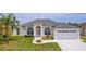 Charming single-story home with a well-manicured lawn and attached two-car garage at 3256 Countryside View Dr, St Cloud, FL 34772