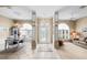 Welcoming foyer with decorative columns, elegant lighting, and tiled floor at 3256 Countryside View Dr, St Cloud, FL 34772