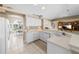 Spacious kitchen features white cabinets, stainless appliances, and an eat-in bar at 3256 Countryside View Dr, St Cloud, FL 34772