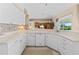 Kitchen area features white cabinets, stainless appliances, and a sink with a backyard view at 3256 Countryside View Dr, St Cloud, FL 34772