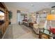 Bright living room with comfortable seating, neutral decor, and sliding glass doors to the outside at 3256 Countryside View Dr, St Cloud, FL 34772