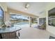 Enclosed patio featuring a pool, seating, and beautiful landscaping at 3256 Countryside View Dr, St Cloud, FL 34772