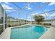 Large screened-in pool with picturesque views of the pond and mature trees in the backyard at 3256 Countryside View Dr, St Cloud, FL 34772