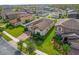 Aerial view of a house in a residential neighborhood featuring manicured lawns and proximity to nearby homes at 3366 Puxton Dr, Orlando, FL 32824