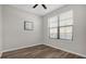 Simple bedroom with ceiling fan and natural light from the window at 3366 Puxton Dr, Orlando, FL 32824