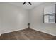 Well-lit bedroom with wood-look floors and a ceiling fan to keep the space cool at 3366 Puxton Dr, Orlando, FL 32824