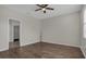 Large bedroom with wood floors, ceiling fan, and a big window at 3366 Puxton Dr, Orlando, FL 32824