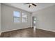 Bedroom with wood floors and two windows for plenty of natural light at 3366 Puxton Dr, Orlando, FL 32824