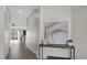 Hallway view showcases wood floors and connections to the kitchen, living spaces, and other areas at 3366 Puxton Dr, Orlando, FL 32824