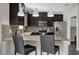 Open concept kitchen with granite countertops, stainless steel appliances, and bar seating at 3366 Puxton Dr, Orlando, FL 32824