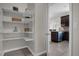Pantry with multiple shelves for plenty of storage. Leads to the kitchen at 3366 Puxton Dr, Orlando, FL 32824