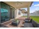Covered patio with outdoor seating overlooking the backyard at 3366 Puxton Dr, Orlando, FL 32824