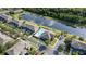 Aerial view of the community highlighting the clubhouse, pool, and pond at 3426 Wilshire Way Rd # 189, Orlando, FL 32829