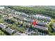 Aerial view of community showcasing location near a lake and parking at 3426 Wilshire Way Rd # 189, Orlando, FL 32829
