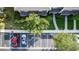 An aerial view of a parking lot and nearby property with beautiful landscaping and greenery at 3426 Wilshire Way Rd # 189, Orlando, FL 32829