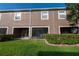 Beautiful backyard featuring a lawn, a screen patio and lush landscaping for added privacy at 3426 Wilshire Way Rd # 189, Orlando, FL 32829