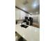 Modern kitchen featuring white cabinets, quartz countertops, and stainless steel appliances at 3426 Wilshire Way Rd # 189, Orlando, FL 32829