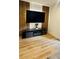 Living room featuring a stylish entertainment center with wood and marble accents at 3426 Wilshire Way Rd # 189, Orlando, FL 32829