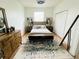 Well-lit main bedroom with a comfortable bed, coordinating nightstands, and a stylish area rug at 3426 Wilshire Way Rd # 189, Orlando, FL 32829