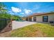 Lush green backyard featuring a brick-paved patio and a fenced pool area, perfect for outdoor relaxation and enjoyment at 3551 Buckingham Ct, St Cloud, FL 34772