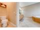 Bathroom with toilet, vanity, and access to the tub and shower areas at 3551 Buckingham Ct, St Cloud, FL 34772