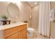 Bathroom with single sink vanity and mosaic tiled shower with white curtain at 3551 Buckingham Ct, St Cloud, FL 34772