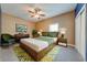 Cozy bedroom featuring a bed with stylish green accents and a ceiling fan at 3551 Buckingham Ct, St Cloud, FL 34772