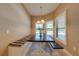 Cozy dining area featuring a built-in bench and large windows for natural light at 3551 Buckingham Ct, St Cloud, FL 34772