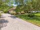 Home with a brick-paved driveway leading to a two-car garage at 3551 Buckingham Ct, St Cloud, FL 34772