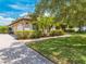 Attractive home exterior with a three-car garage, brick accents, and a paved driveway at 3551 Buckingham Ct, St Cloud, FL 34772