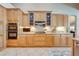 Kitchen featuring wooden cabinets, stainless steel appliances, and tile flooring at 3551 Buckingham Ct, St Cloud, FL 34772
