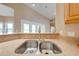 Close up of kitchen sink with granite countertops, and bright natural lighting at 3551 Buckingham Ct, St Cloud, FL 34772