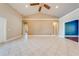 Large, open living space featuring tile floors, neutral walls, and vaulted ceilings, perfect for entertaining at 3551 Buckingham Ct, St Cloud, FL 34772