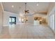 Open-concept living space with a kitchen, dining area, and vaulted ceilings at 3551 Buckingham Ct, St Cloud, FL 34772